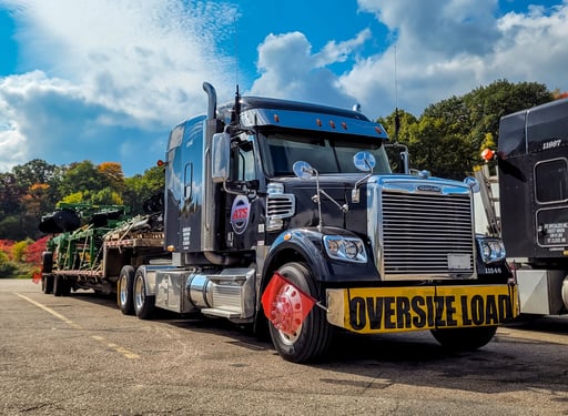 ATS Flatbed with an Oversize Load parked in lot. Memorial Day 2026 Oversize Freight Restrictions