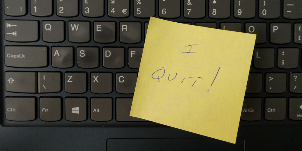 Yellow post-it note that says "I Quit!" It sits on a black keyboard.