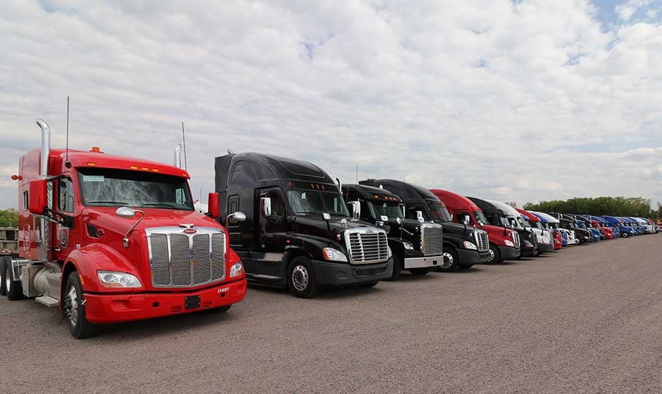 30-ATS-semi-trucks-lined-up-trailer-yard