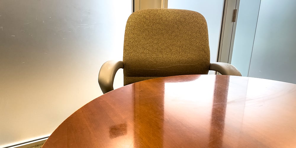 Empty-Chair-in-Conference-Room