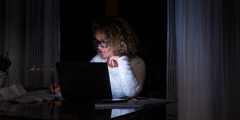 Woman working late on laptop