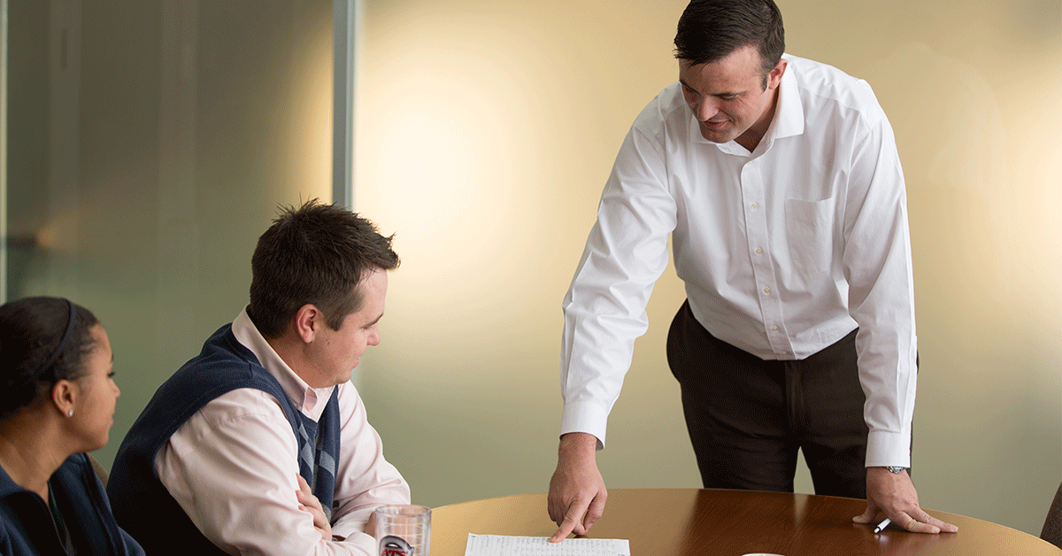 Sales manager teaching sales representative