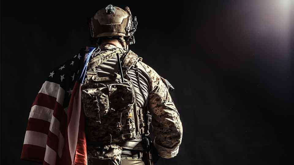 Back-of-soldier-American-flag-draped-over-shoulder