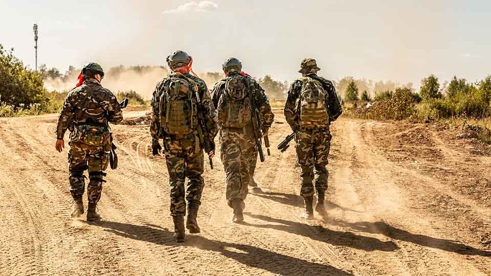 Four-army-soldiers-walking-during-training-exercise