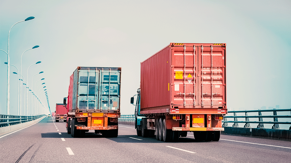 Two-container-trucks-on-roadway