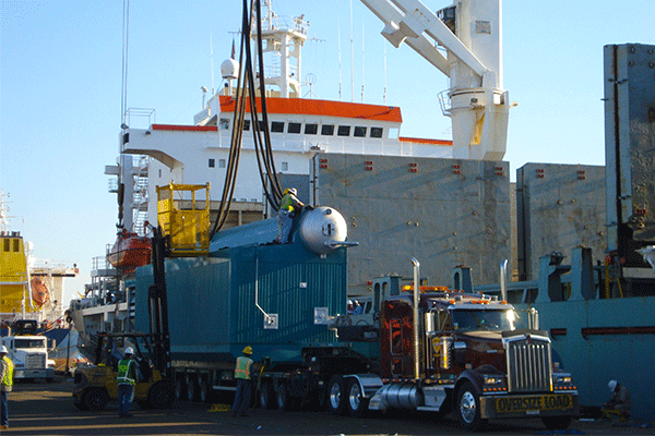 crane-loading-heavy-haul-truck-at-port