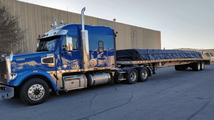 Flatbed freight shipment with tarps