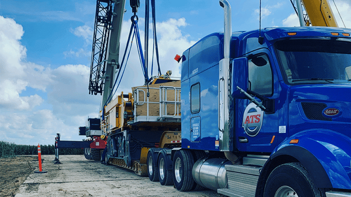 heavy-haul-shipment-being-loaded-by-crane