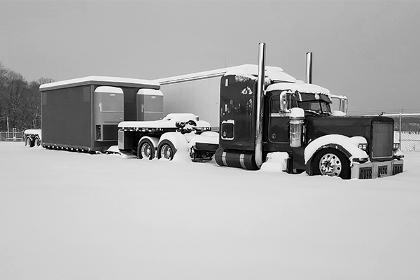 semi-truck-and-trailer-covered-in-snow