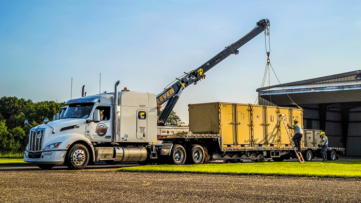 crane-loading-flatbed-trailer
