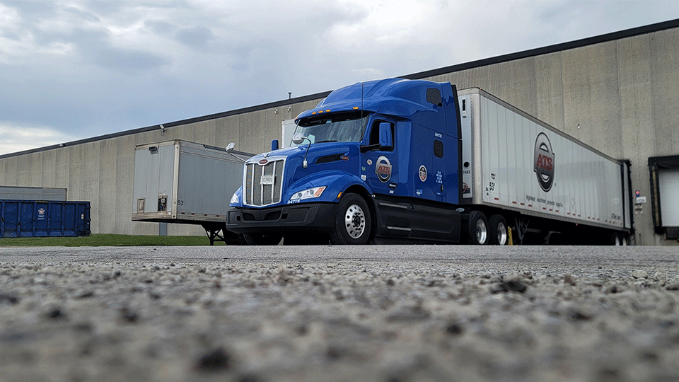 An ATS dry van is loaded at a loading dock