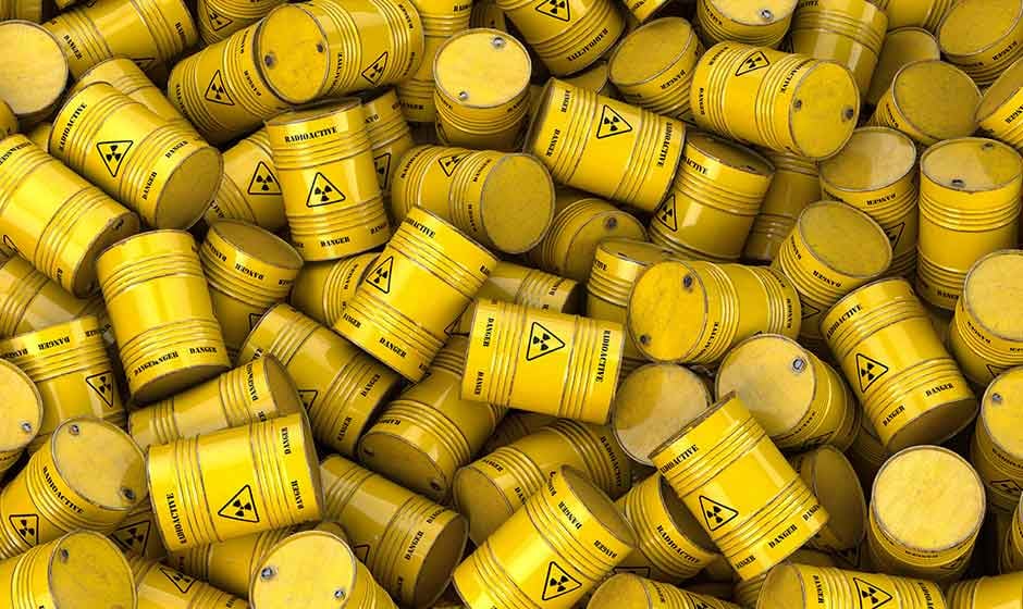 Yellow hazardous containers in a pile