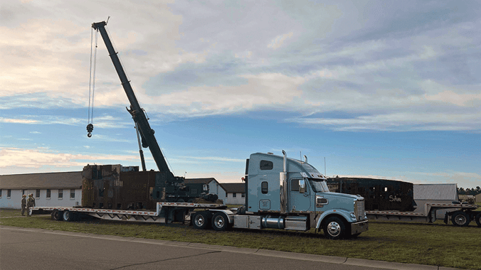 Flabed-trailer-being-loaded-by-crane