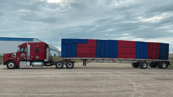 Tarped-freight-open-deck-trailer