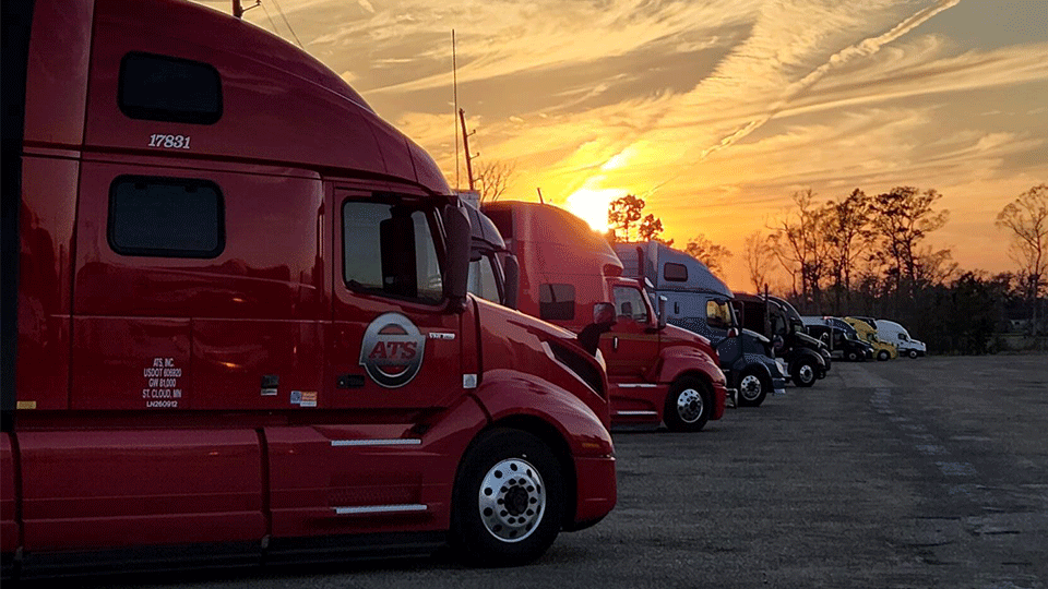 10-semi-trucks-in-row-dusk