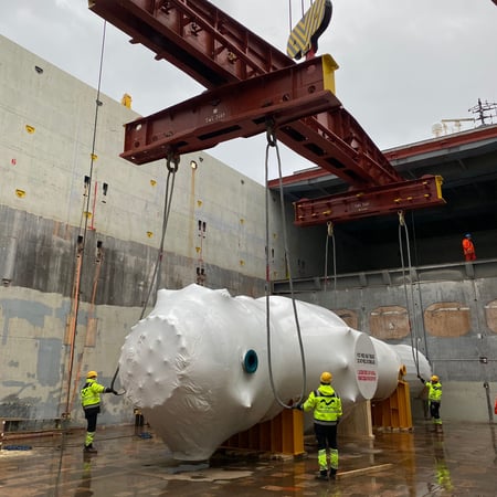 Tube bundle being loaded onto vessel using crane
