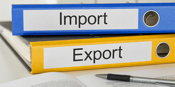Binders with Import and Export on them containing documents