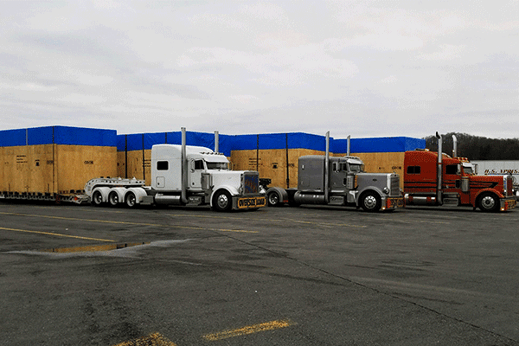 Three trucks with oversized freight