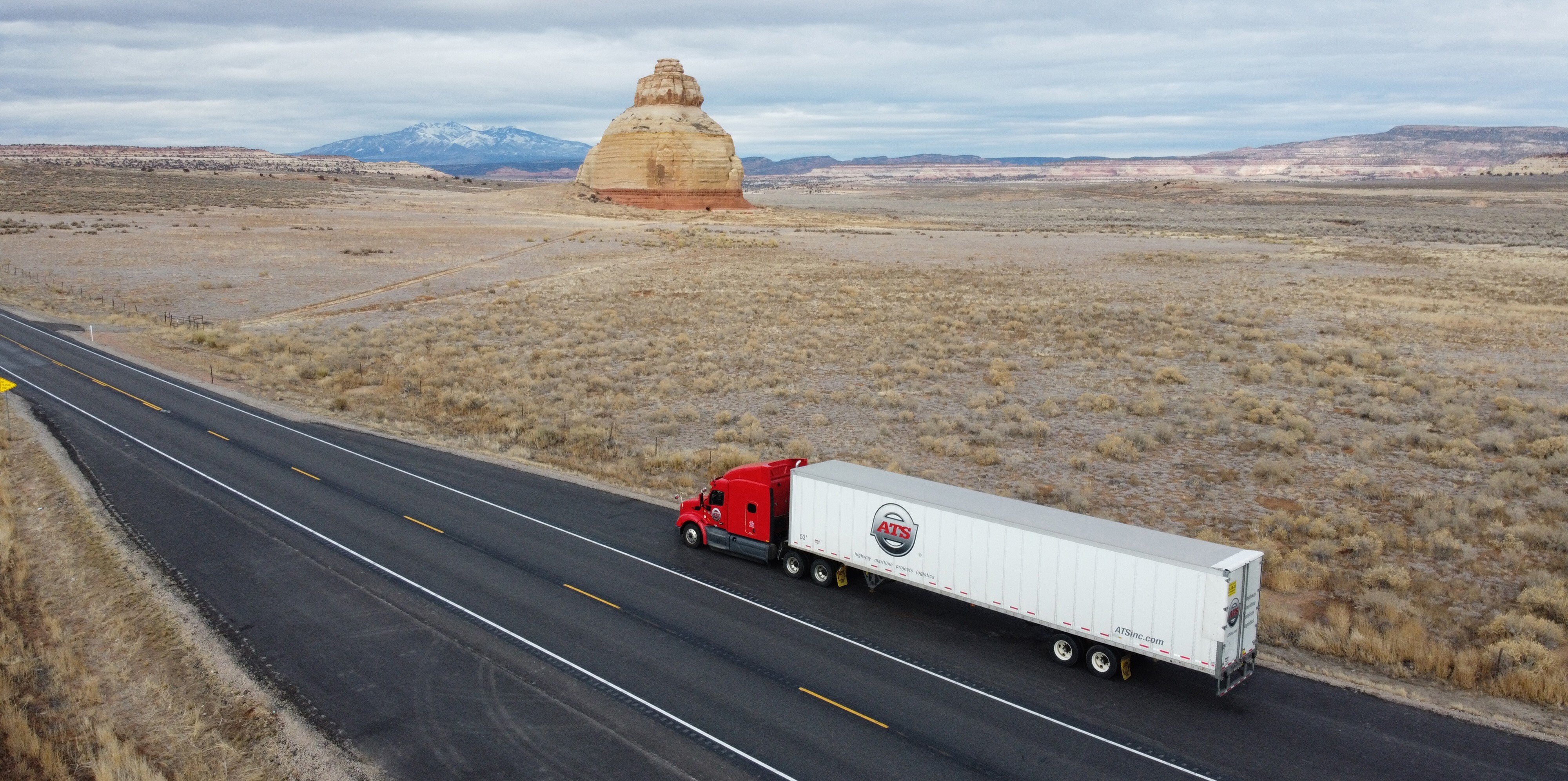 red-ats-truck-driving-highway-in-arizona
