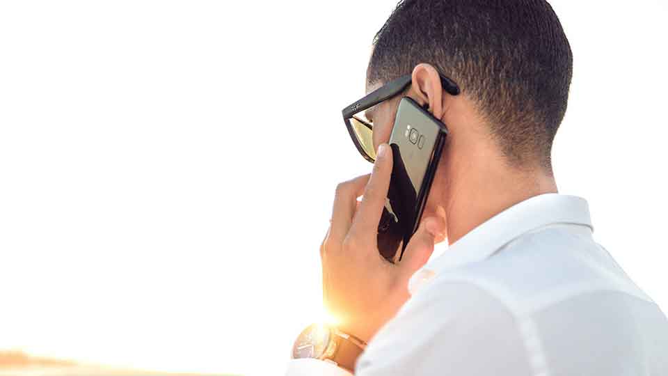 person answering a cell phone call