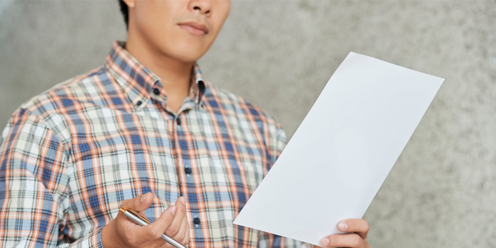 A man reviews a payment document