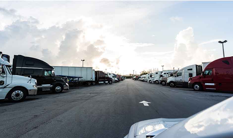 Semi trucks lined up at truck stop