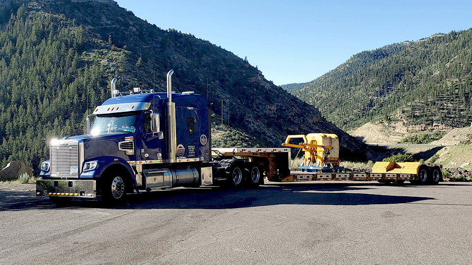 truck driver hauling freight down interstate