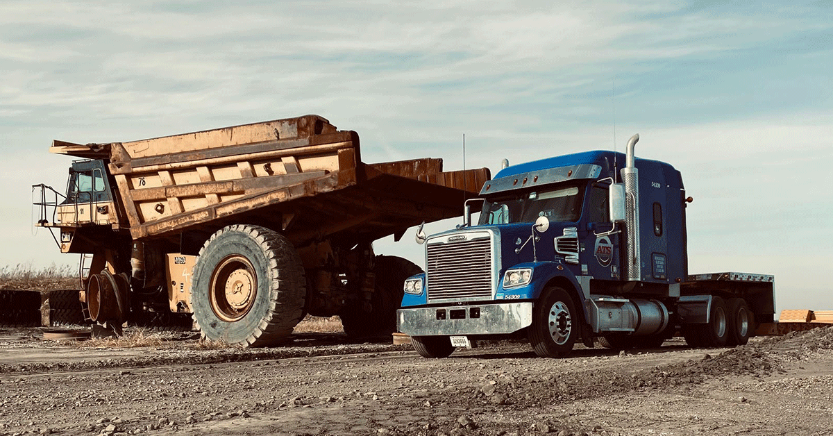 Semi-Truck-on-Construction-Site-Next-to-Machinery