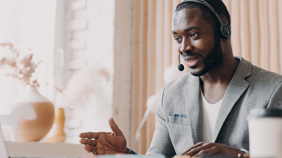 Freight broker on headset with customer