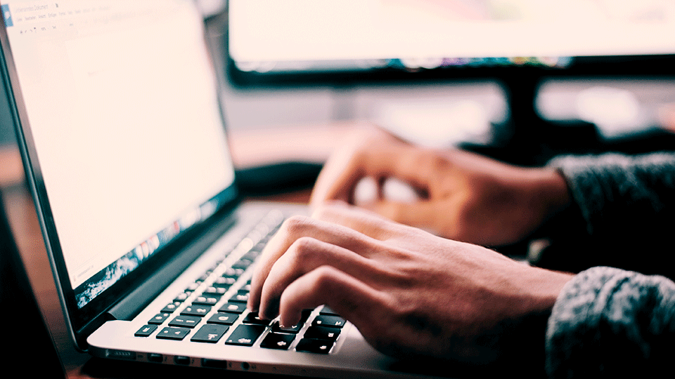 shipper-accessing-customer-portal-via-laptop