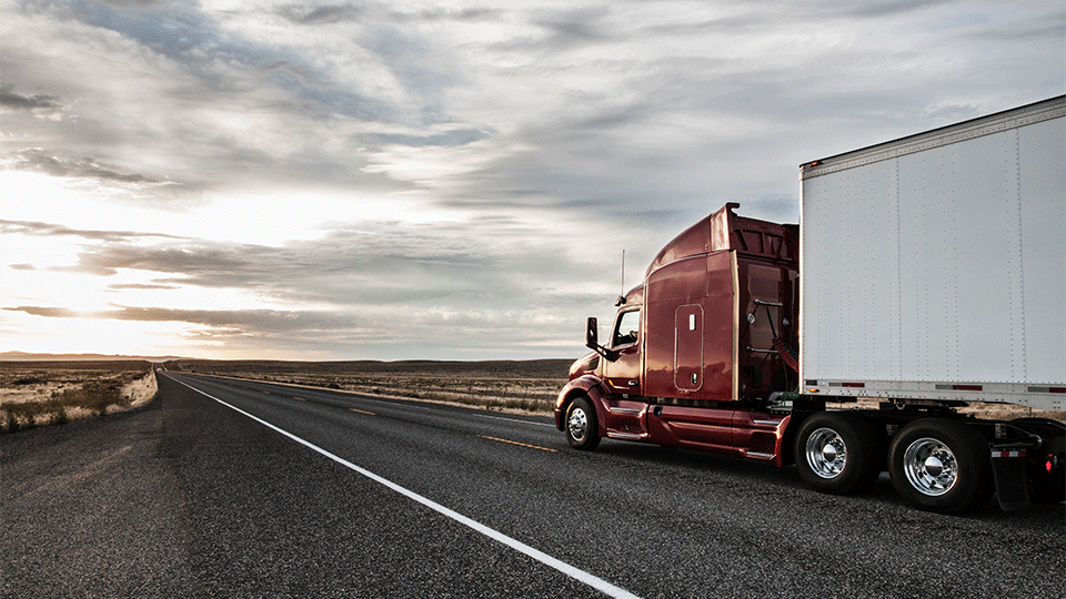 Red-Semi-Truck--Driving-Highway