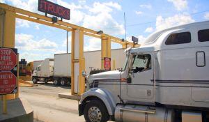A semi truck waits for entry at the Canadian border