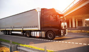 A truck with a Conestoga or curtainside trailer