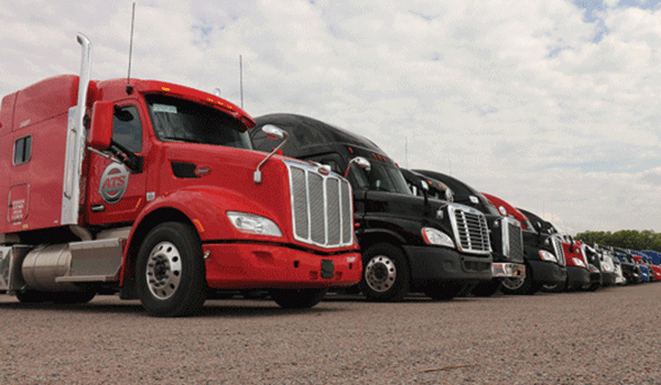 Semi tractors parked in a line
