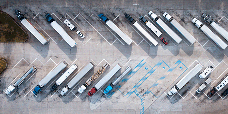 semi trucks parked at truck stop
