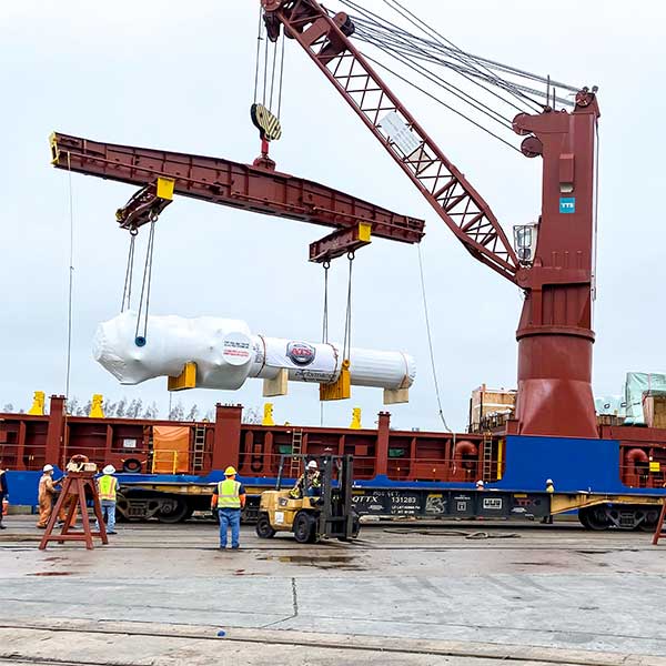 Breakbulk cargo unloading from ship via crane at port