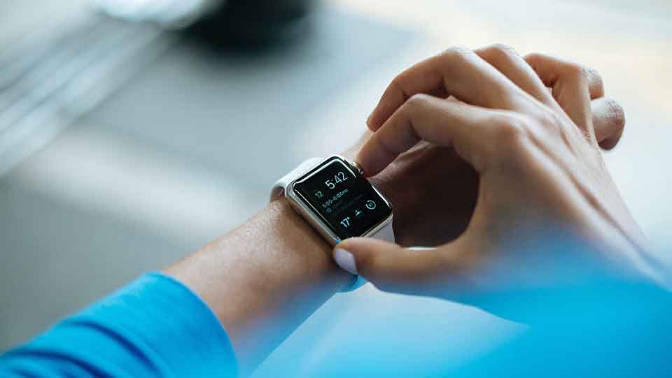 Person setting a smart watch