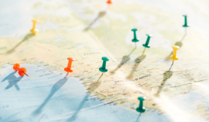 A map of the US with push pins denoting cities